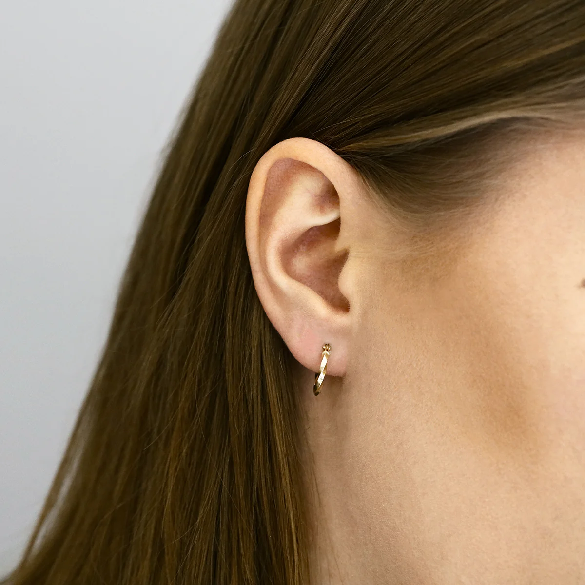 Soleil Collection 10mm Twist Hoop Earrings | 9K Yellow Gold - Image 6